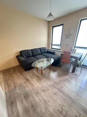a living room with a couch and a table at Paradise Comfort in Sofia