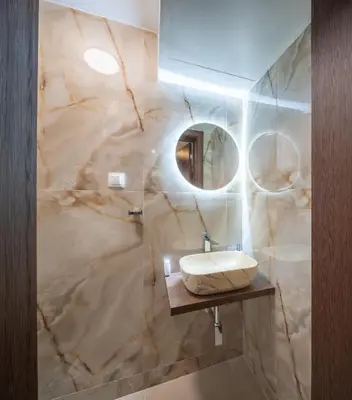 a bathroom with a sink and a mirror at Top Centre Spacious 2 bedroom Apartment in Sofia