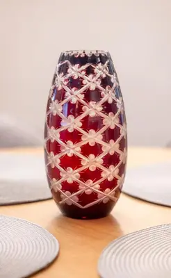 a vase sitting on a table with two plates at Top Centre Spacious 2 bedroom Apartment in Sofia