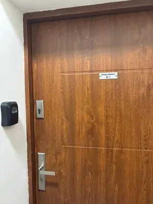 a wooden door with a sign on it at Kolev Apartment 1 in Sofia
