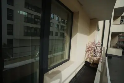 a window in a building with a potted plant at Royal nest in Sofia