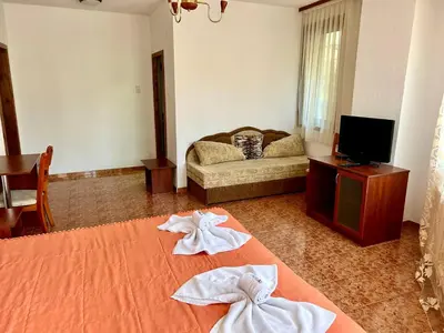 a hotel room with two towels on a bed at Trigrad hills in Trigrad