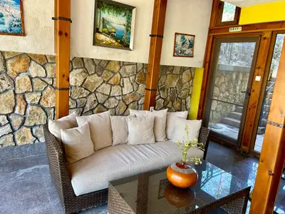a living room with a couch and a table at Trigrad hills in Trigrad