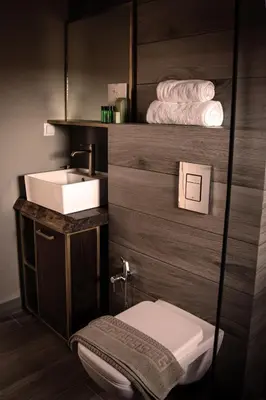 a bathroom with a sink and a toilet and towels at Luxury House Veles in Hisarya
