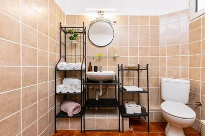 a bathroom with a sink and a toilet at Stancho's House 3BR apartment close to OLD TOWN & KAPANA district in Plovdiv