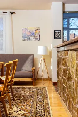 a living room with a couch and a fireplace at Stancho's House 3BR apartment close to OLD TOWN & KAPANA district in Plovdiv