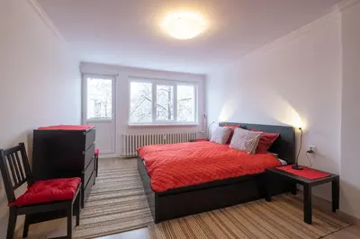 a bedroom with a bed and a chair in it at LZ Spacious One Bedroom Apartment in Top Centre by Flat Mаnager in Sofia