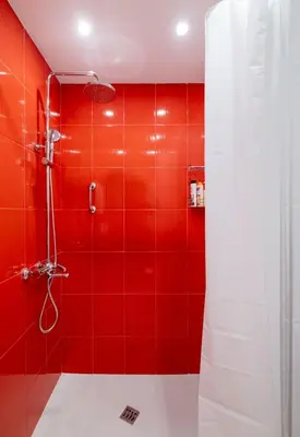 a red bathroom with a shower with red tiles at LZ Spacious One Bedroom Apartment in Top Centre by Flat Mаnager in Sofia