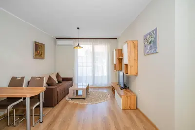 a living room with a couch and a table at 1BD Apartment in Sofia City Center by Flat Mаnаger in Sofia