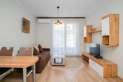 a living room with a couch and a television at 1BD Apartment in Sofia City Center by Flat Mаnаger in Sofia