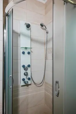 a shower in a bathroom with a glass door at 1BD Apartment in Sofia City Center by Flat Mаnаger in Sofia