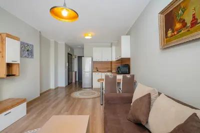 a living room with a couch and a table at 1BD Apartment in Sofia City Center by Flat Mаnаger in Sofia