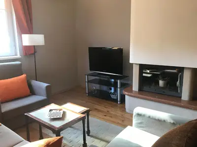 a living room with a couch and a tv at Beautiful Business Apartment - Ivan Denkoglu Street by Flat Mаnager in Sofia