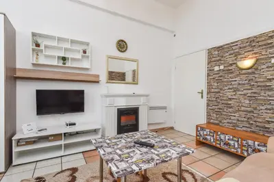 a living room with a fireplace and a tv at Historical Lion's Bridge 1-Bedroom Apartment by Flat Mаnager in Sofia