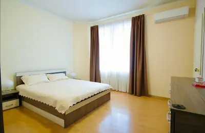 a bedroom with a bed and a large window at Къща за гости,, Зафир,, in Sofia