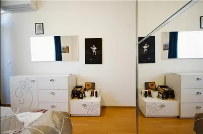 a bedroom with a bed and a dresser and a mirror at Къща за гости,, Зафир,, in Sofia