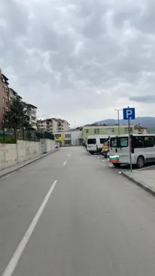 a parking lot with cars parked on the side of a street at Djanina 3 in Sandanski