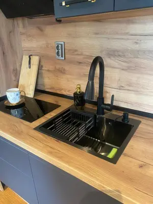 a kitchen sink with a faucet and a counter at Djanina 3 in Sandanski