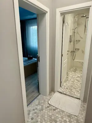 a bathroom with a walk in shower and a shower at ElenartLux - Baby Cot - Pets Allowed - Free Parking & Fast Wi-Fi in Plovdiv
