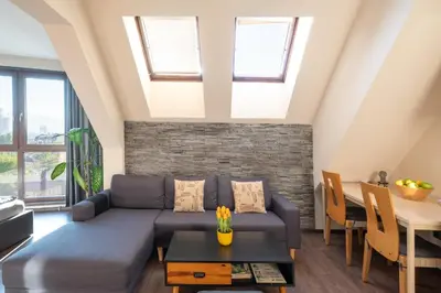 a living room with a couch and a table at Studio Talisman V in Sofia