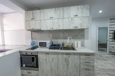 a kitchen with a sink and a microwave at Secret Guest House in Plovdiv