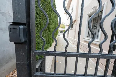 a gate with a view of a sidewalk at Secret Guest House in Plovdiv
