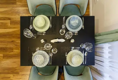 a display of clocks and other items on a table at Klimt's Puzzle Suite in Sofia