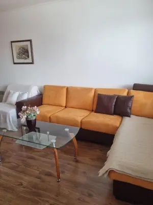 a living room with a couch and a coffee table at Ski & View Pamporovo Apartment in Smolyan