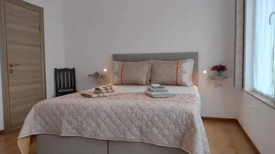 a bedroom with a bed with two pairs of shoes on it at Sofia Harmony Tranquility Comfort and Free Parking in Sofia