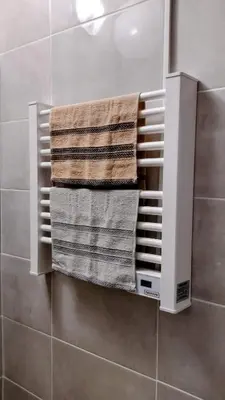 a towel rack in a bathroom with three towels at Sofia Harmony Tranquility Comfort and Free Parking in Sofia