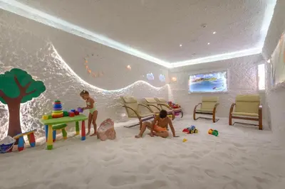 a toy room with two children playing in the sand at Donna Spa hotel Sveti Spas in Velingrad