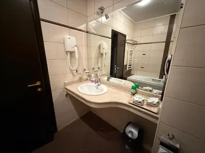 a bathroom with a sink and a mirror at Donna Spa hotel Sveti Spas in Velingrad