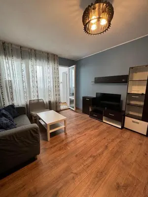 a living room with a couch and a table at Cozy Corner in Nadezhda in Sofia