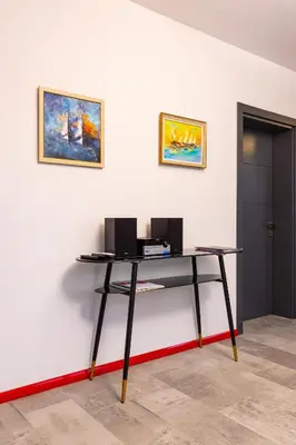 a desk with two monitors on a white wall at Plovdiv Urban Gem 2BD Apartment by Flat Mаnаger in Plovdiv