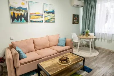a living room with a couch and a table at Saltwater Apartments in Sandanski