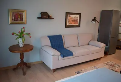 a living room with a couch and a table at Studio 42 Plovdiv in Plovdiv