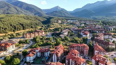 an aerial view of a city with mountains in the background at Cozy Mountain-View Apartment in Belmont, Bansko by Flat Mаnager in Bansko