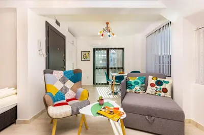 a living room with a couch and a chair at Plovdiv Urban Gem Studio by Flat Mаnаger in Plovdiv