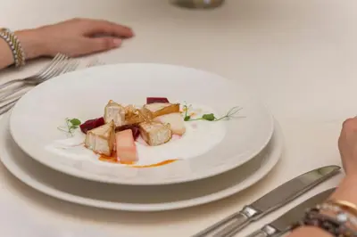 a plate of food sitting on a table at Saint Sofia Golf Club, Hotel and SPA in Robertowo