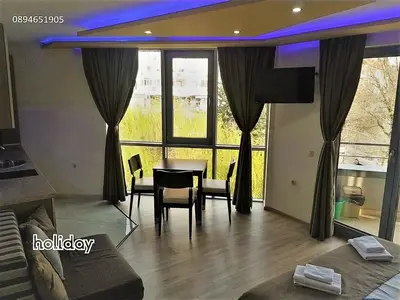 a dining room with a table and chairs in a room at 