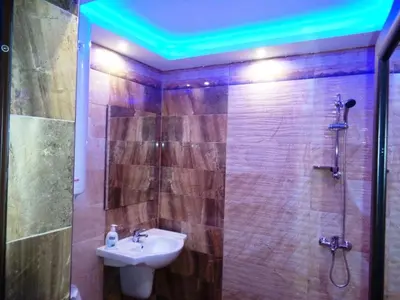 a bathroom with a sink and a shower with a sink at 