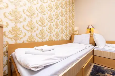 a bedroom with two beds with white sheets at 1-Bedroom Flat with Balcony in Plovdiv by Flat Mаnager in Plovdiv