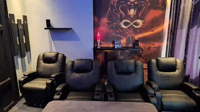 a therapy room with two chairs and a poster at Key Hostel Serdika in Sofia