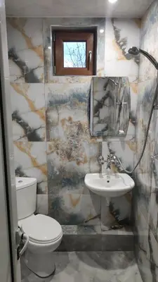 a bathroom with a toilet and a sink at Лазов in Sapareva Banya