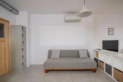a bedroom with a bed in a white room at Bright and Cozy 1BD Apartment plus Desk by Flat Mаnаger in Sofia