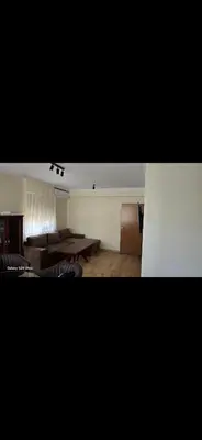 a living room with a couch and a table at Macedonia55 in Sandanski