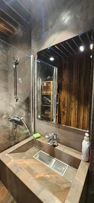 a bathroom with a sink and a mirror at Elegant and cozy apartment in Sofia