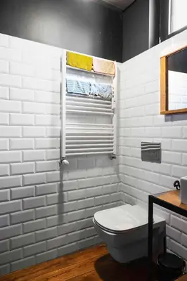 a white bathroom with a toilet and a window at Central Sanctuary 3BD by Flat Mаnаger in Sofia