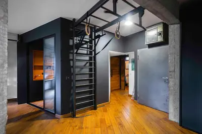 a room with a staircase in the middle of a room at Central Sanctuary 3BD by Flat Mаnаger in Sofia