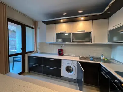 a kitchen with a washing machine in the middle at Victoria apartment - Sandanski in Sandanski